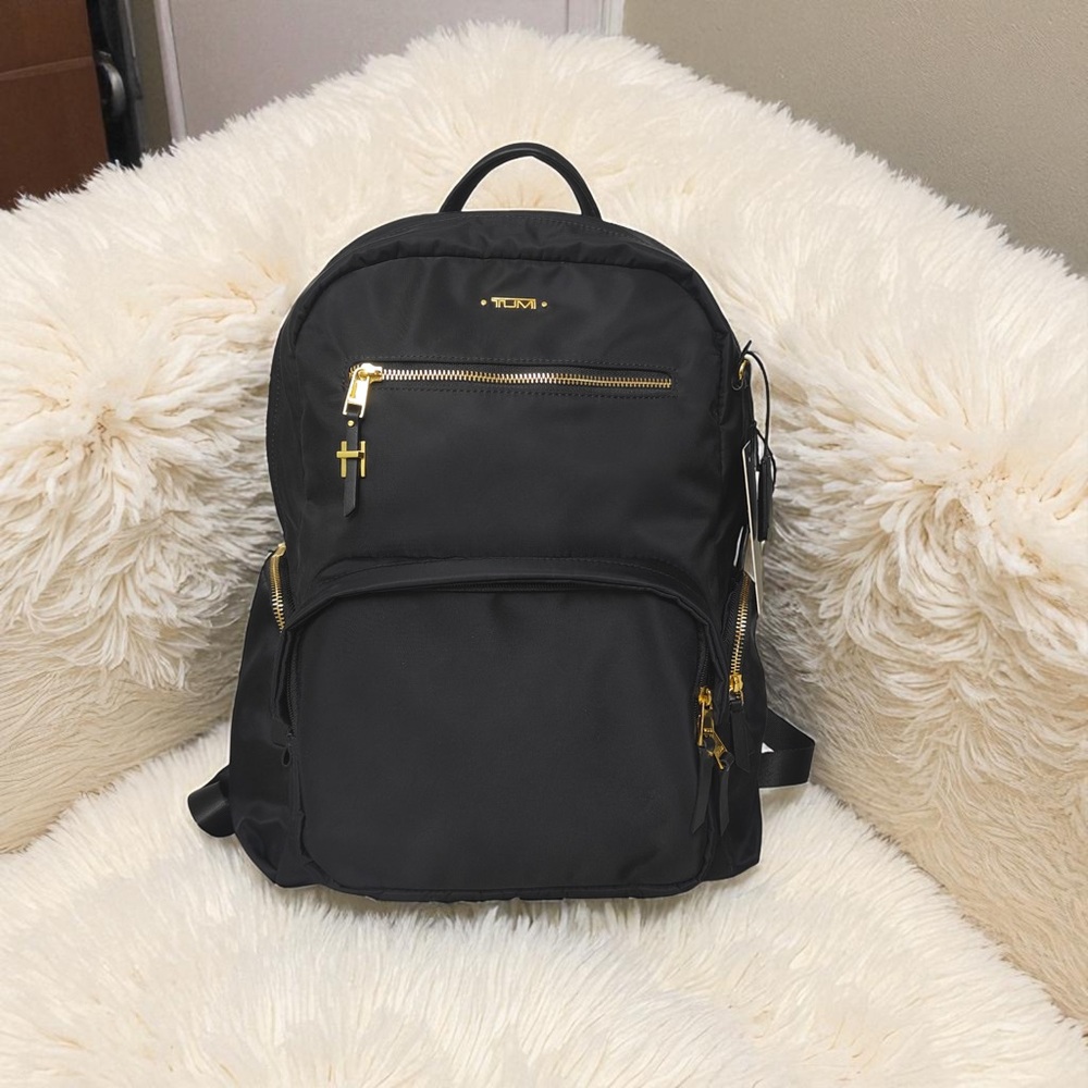 Tumi Black Backpack with Gold Accents